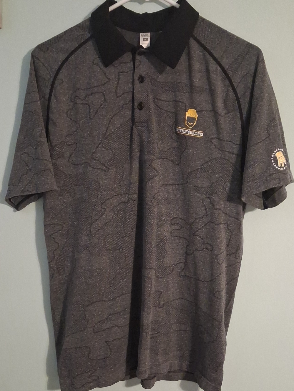 Men's Gray Polo Shirt with Black Collar and Subtle Pattern
